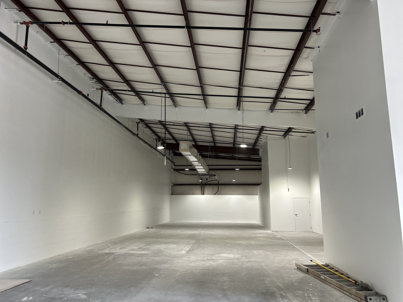 Wide view of completed commercial gym interior painting in Clermont Florida